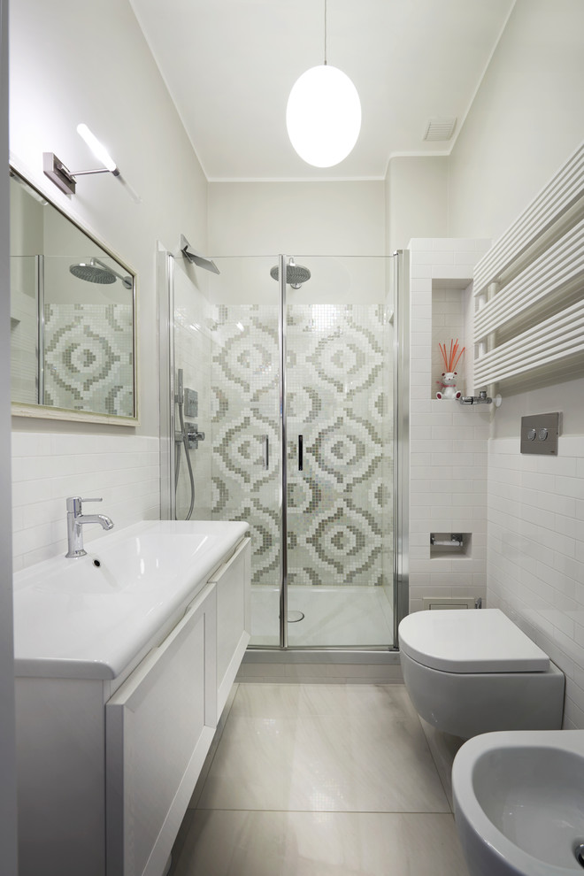 This is an example of a medium sized retro ensuite bathroom with raised-panel cabinets, white cabinets, an alcove shower, a bidet, white walls, a trough sink and a hinged door.