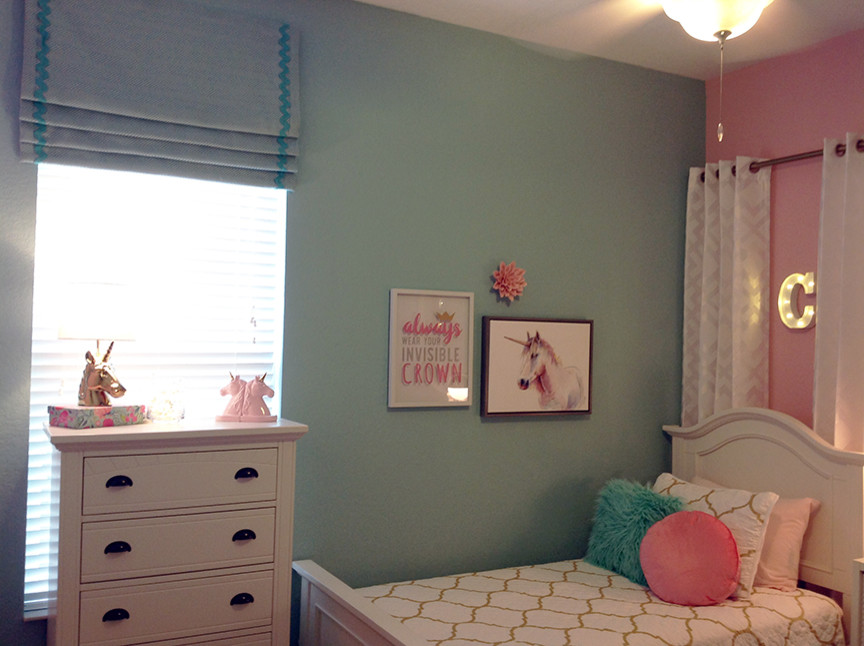 Photo of a small transitional bedroom in Orlando with pink walls, carpet, no fireplace and multi-coloured floor.