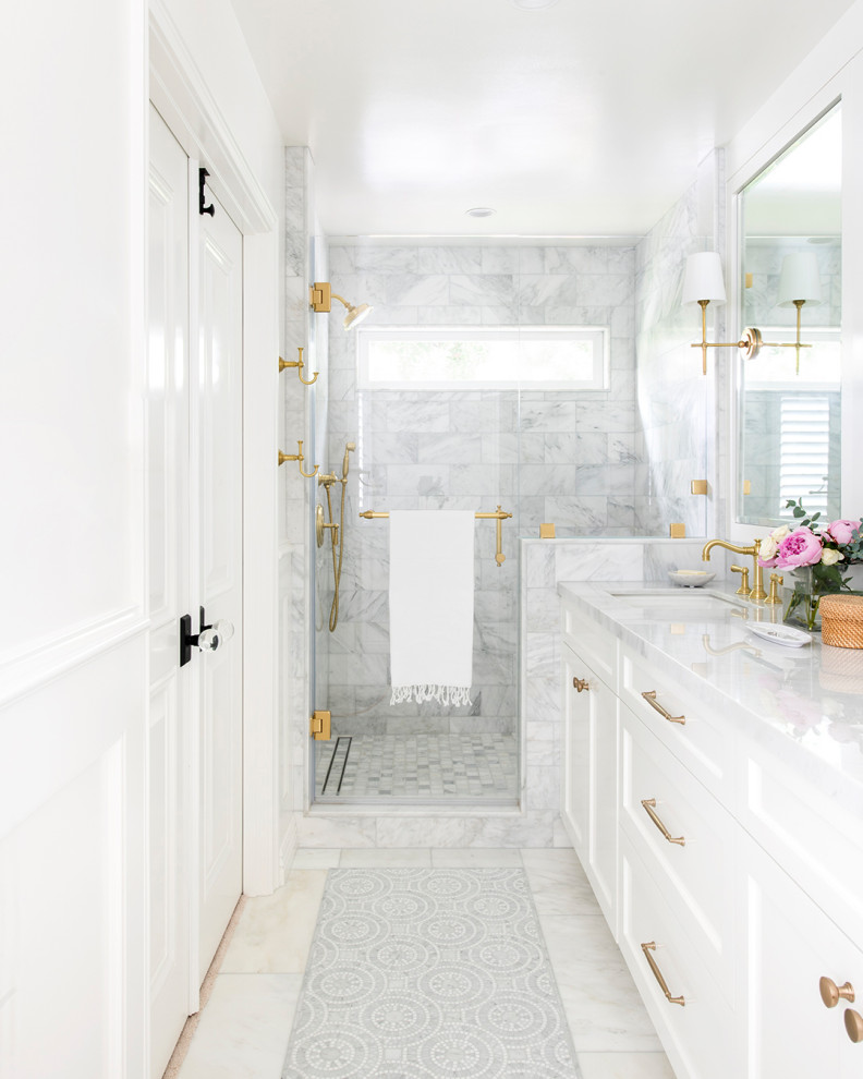 Photo of a small beach style half tiled bathroom in Los Angeles with grey cabinets, white tiles, ceramic tiles, a submerged sink, white worktops and a single sink.