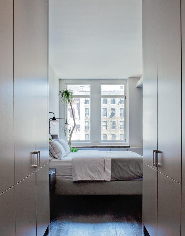 Inspiration for a contemporary bedroom in New York with white walls.
