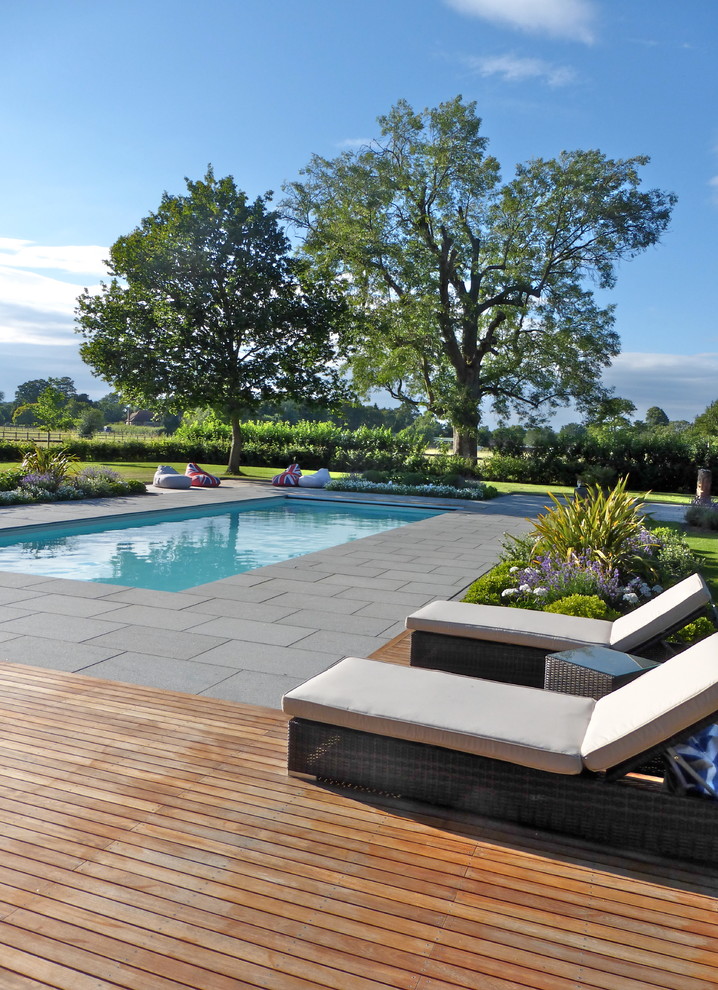 Contemporary pool in London with stamped concrete.