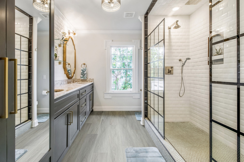 Modern ensuite bathroom in Los Angeles with shaker cabinets, black cabinets, a walk-in shower, a one-piece toilet, white tiles, metro tiles, white walls, vinyl flooring, a built-in sink, marble worktops, grey floors, an open shower, brown worktops, double sinks and a floating vanity unit.