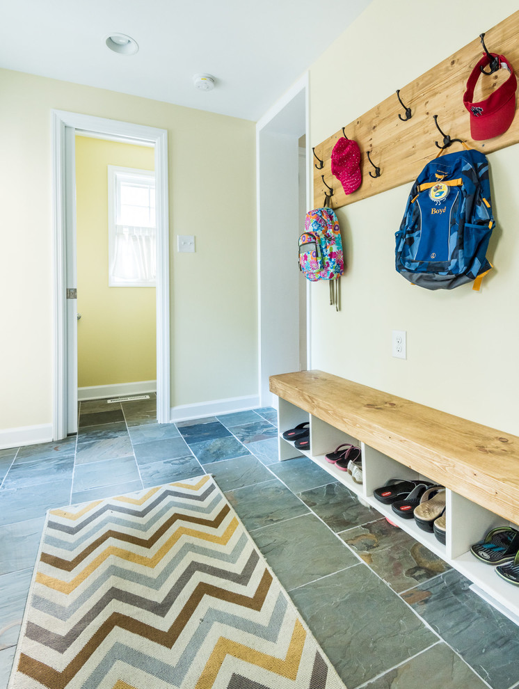 Inspiration for a mudroom in Richmond with yellow walls, slate floors and grey floor.