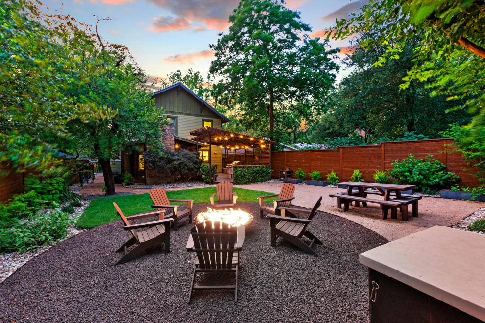 Photo of a small craftsman backyard wood fence landscaping in Austin with decking.