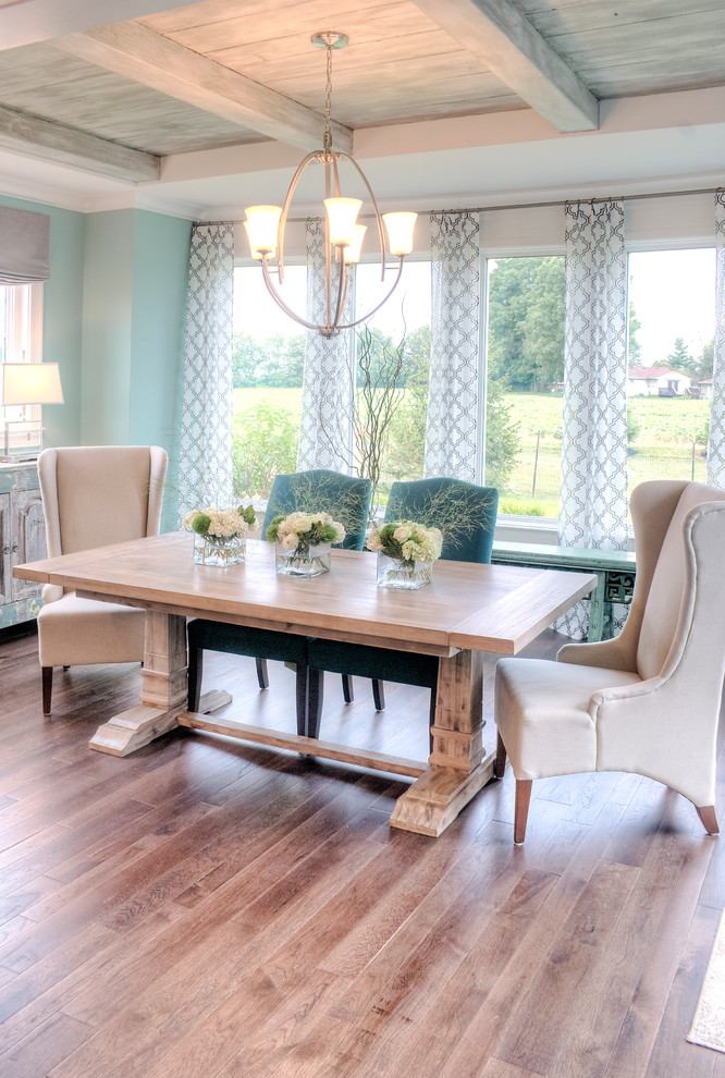 Design ideas for a transitional dining room in Louisville with blue walls and dark hardwood floors.