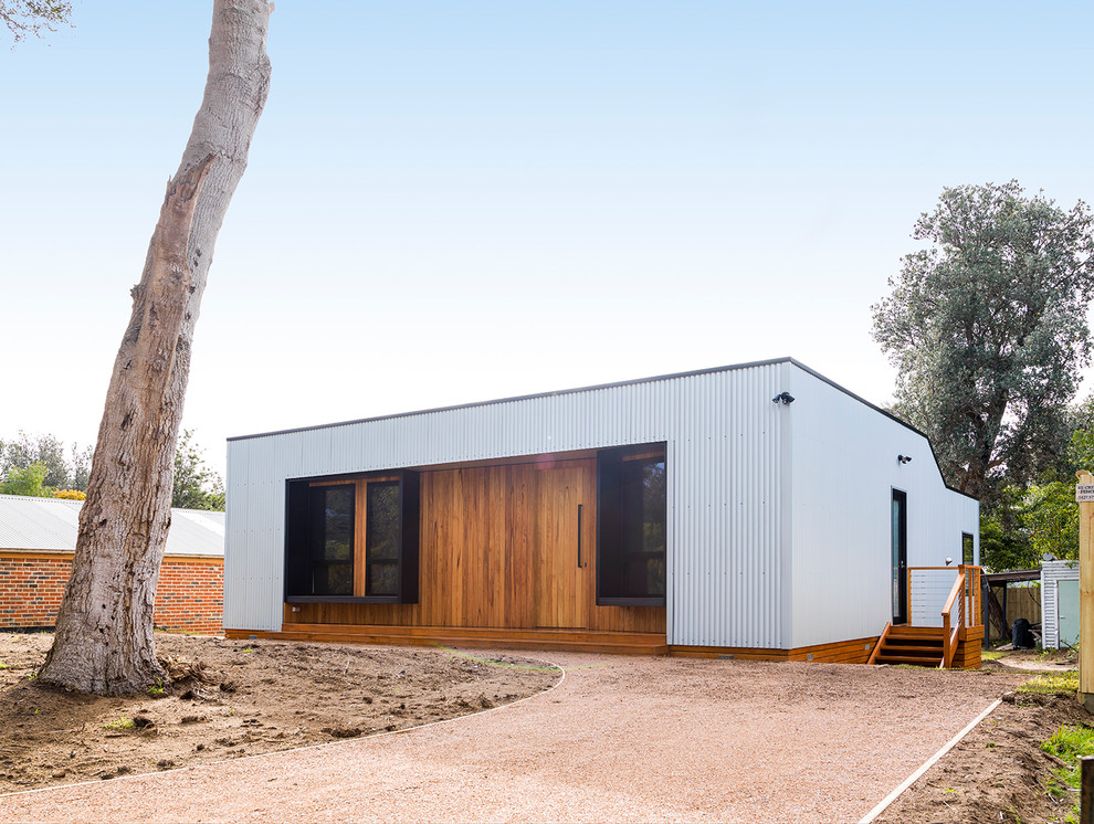 Photo of a beach style home design in Melbourne.