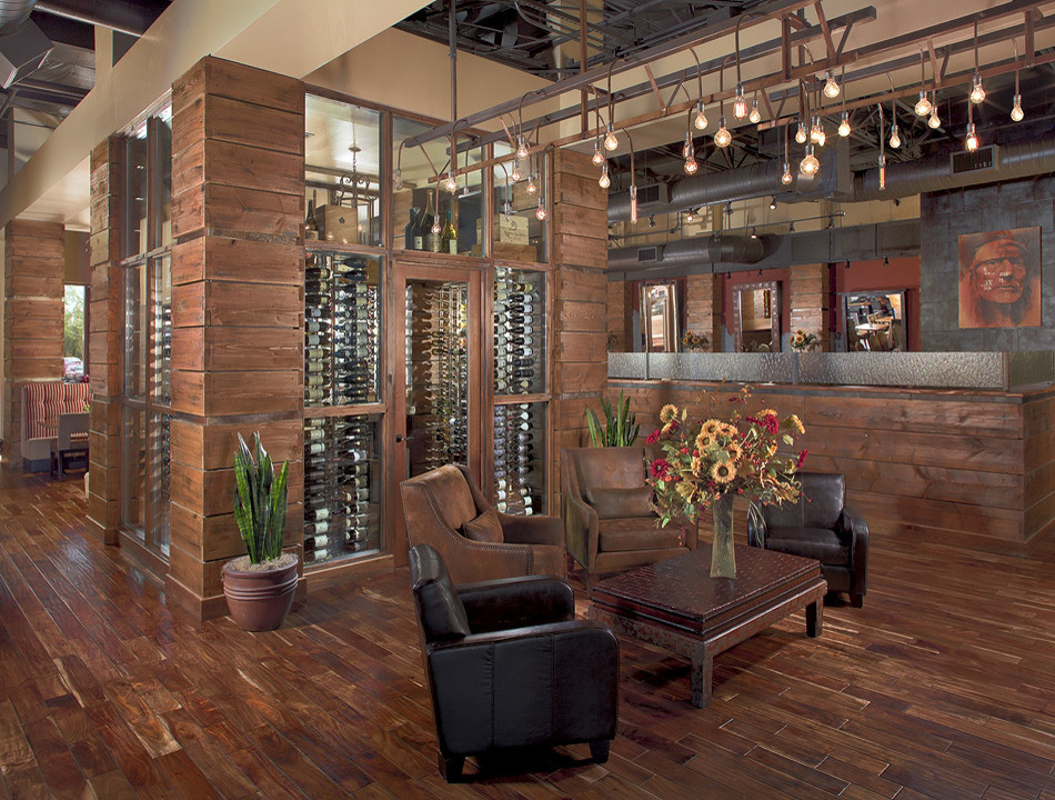 Mid-sized contemporary wine cellar in Phoenix with display racks, ceramic floors and grey floor.