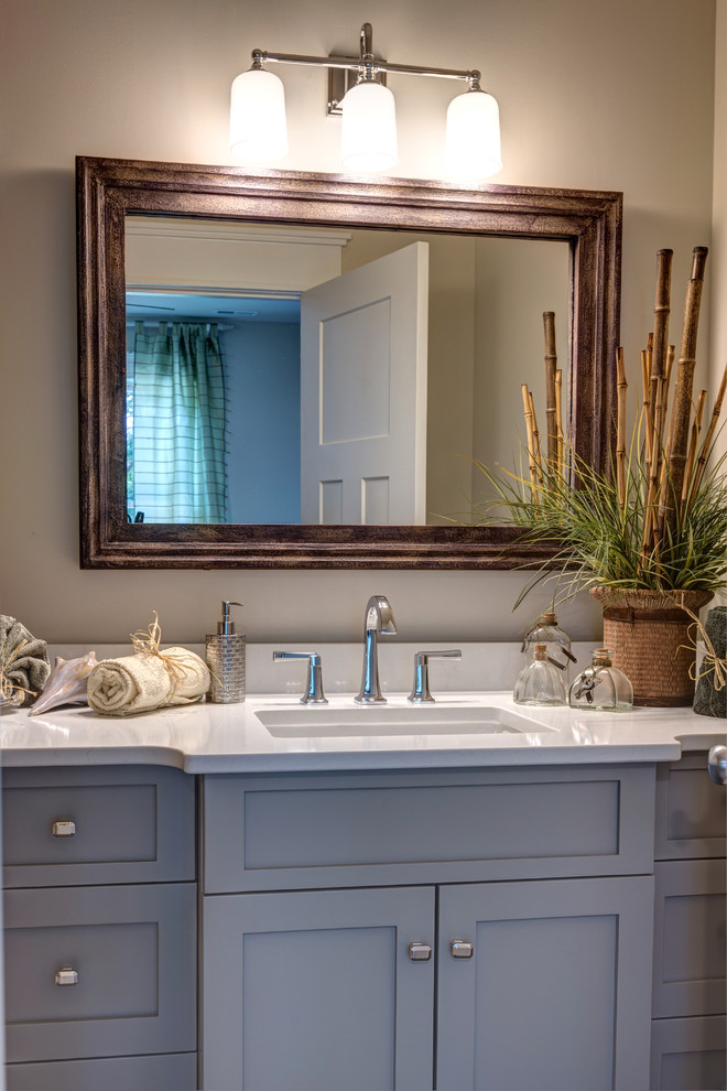 Mid-sized transitional master bathroom in Other with shaker cabinets, grey cabinets, a freestanding tub, an alcove shower, a two-piece toilet, beige tile, ceramic tile, blue walls, porcelain floors, an undermount sink and engineered quartz benchtops.