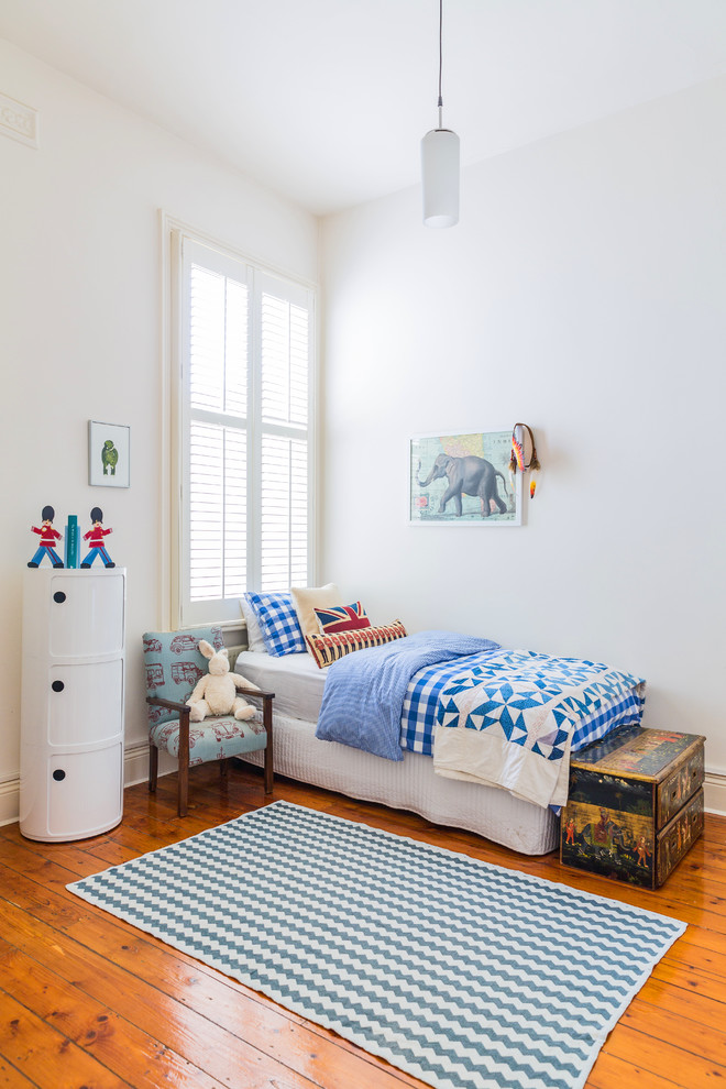 Inspiration for an eclectic kids' bedroom for boys in Melbourne with white walls and medium hardwood floors.