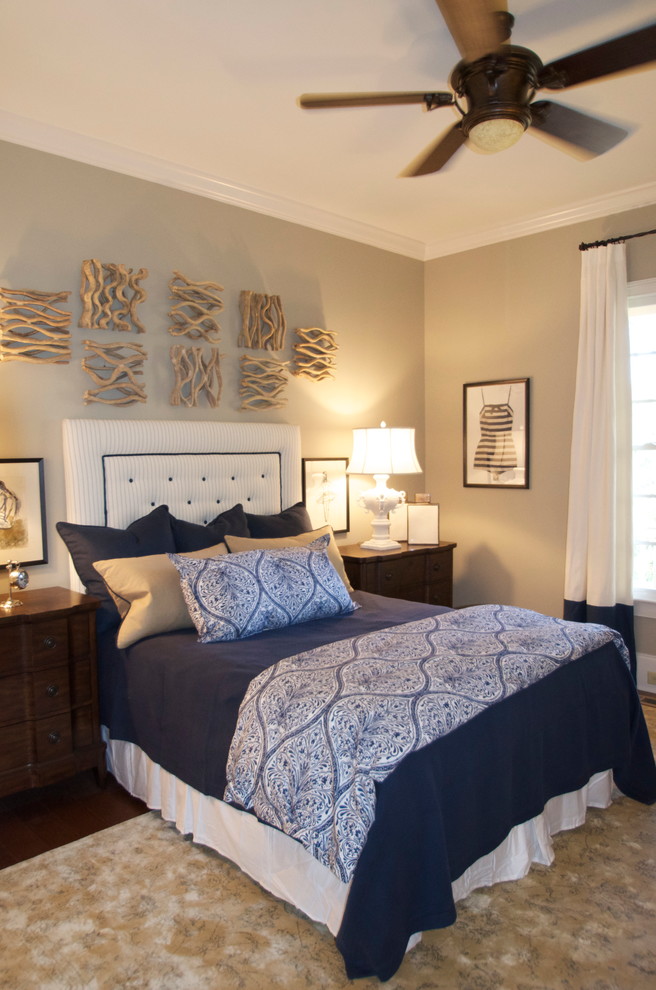 This is an example of a transitional guest bedroom in Other with carpet and beige walls.