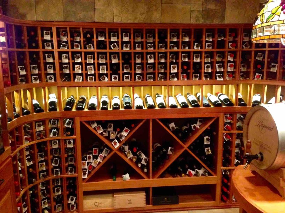 Inspiration for a mid-sized traditional wine cellar in Dallas with storage racks.
