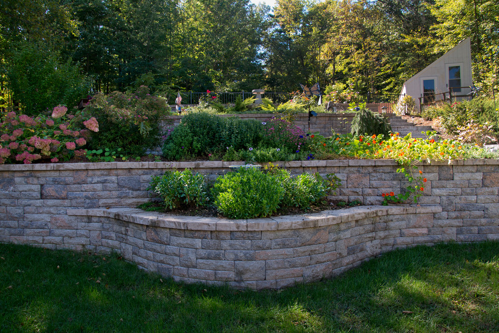 Inspiration for a rustic front yard concrete paver driveway in Boston.