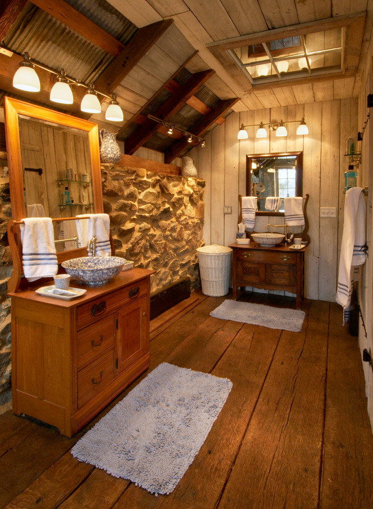 Design ideas for a mid-sized country master bathroom in Philadelphia with a vessel sink, furniture-like cabinets, medium wood cabinets, wood benchtops, white walls and dark hardwood floors.