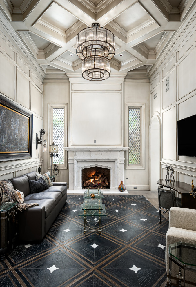 Inspiration for a home office in Phoenix with a library, a standard fireplace, a stone fireplace surround, a freestanding desk, black floor and coffered.