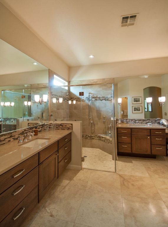 Design ideas for a large traditional master bathroom in Phoenix with furniture-like cabinets, dark wood cabinets, a corner shower, multi-coloured tile, matchstick tile, beige walls, limestone floors, an undermount sink, engineered quartz benchtops, beige floor and a hinged shower door.