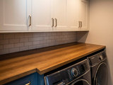 Transitional Laundry Room by Corinthian Fine Homes