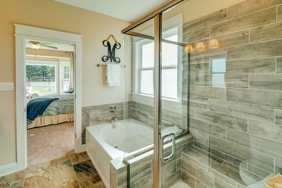 Design ideas for a mid-sized traditional master bathroom in Richmond with shaker cabinets, grey cabinets, an alcove tub, an alcove shower, a two-piece toilet, gray tile, porcelain tile, ceramic floors, an integrated sink, solid surface benchtops, brown floor and a hinged shower door.