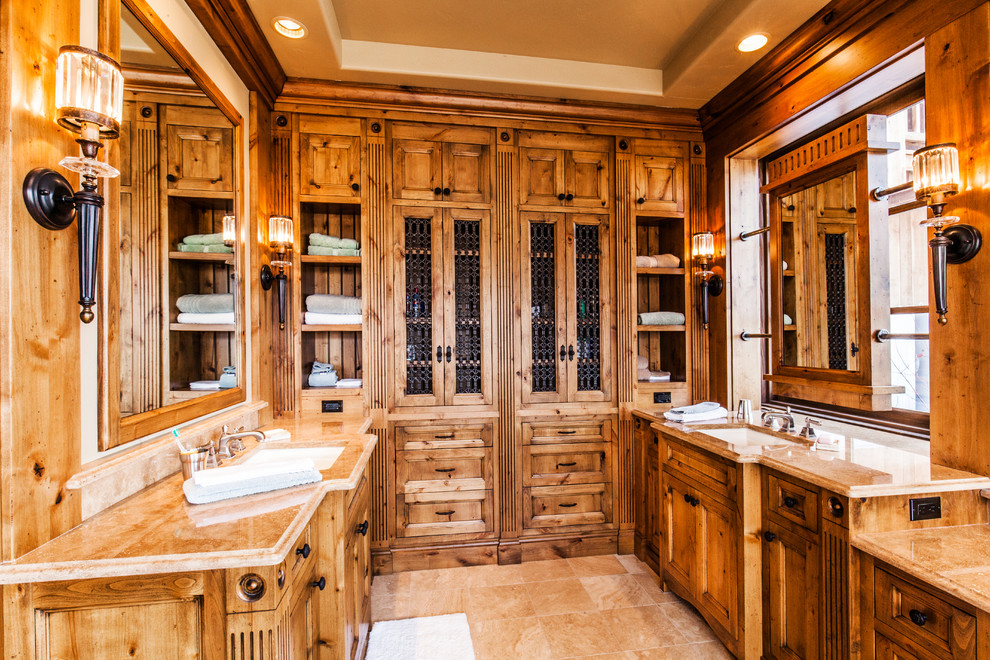 Double shower - large rustic master beige tile and ceramic tile ceramic tile double shower idea with beaded inset cabinets, medium tone wood cabinets, an undermount tub, beige walls, an undermount sink and granite countertops