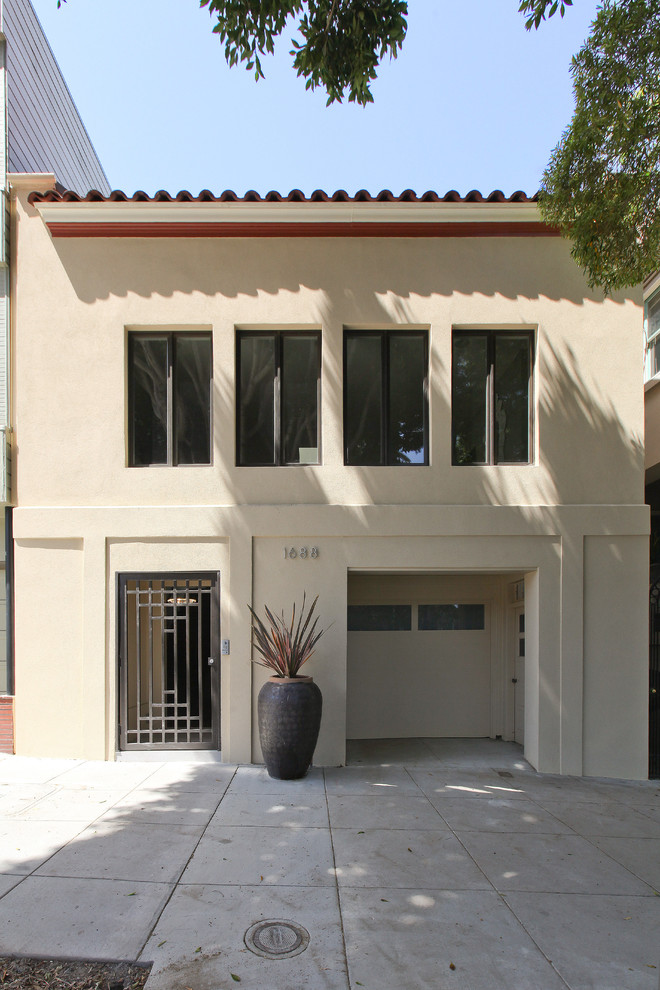 Large modern two-storey stucco beige exterior in San Francisco with a flat roof.