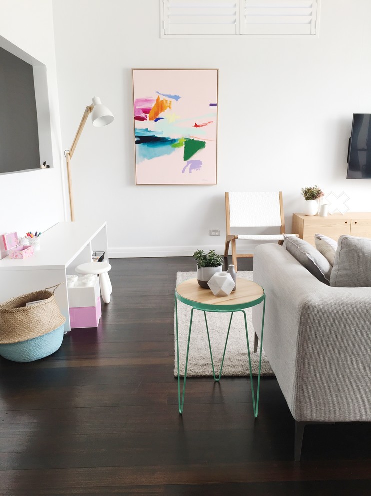 Inspiration for a mid-sized scandinavian open concept living room in Sydney with white walls, dark hardwood floors, no fireplace and a wall-mounted tv.