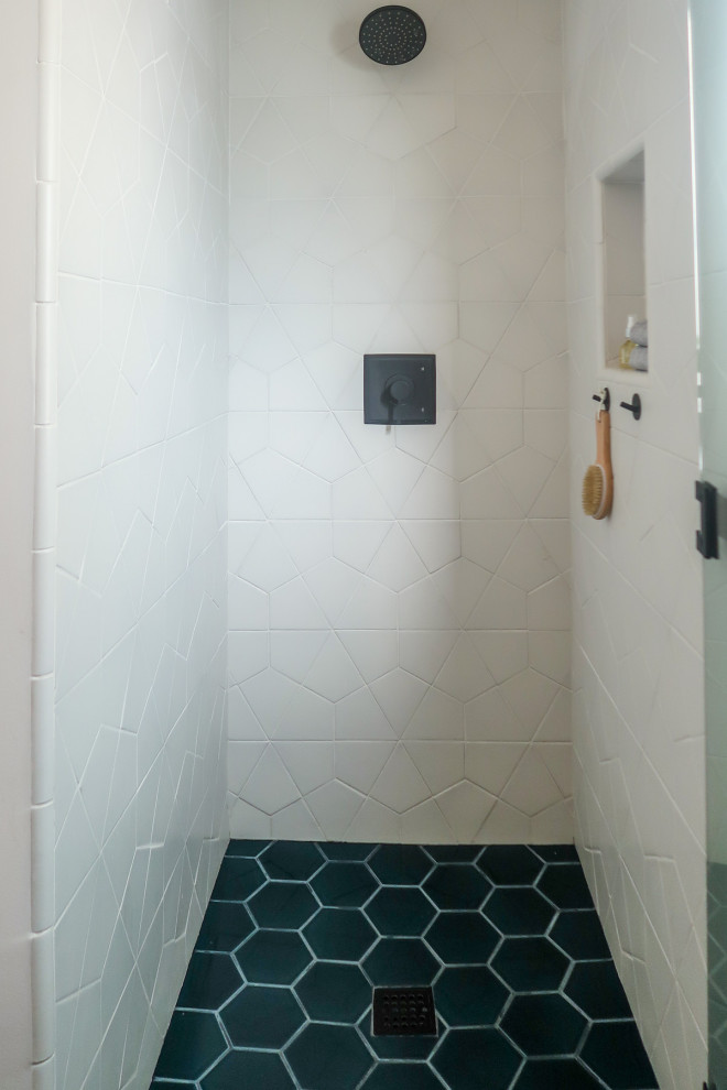 Mid-sized contemporary 3/4 bathroom in Los Angeles with a corner shower, white tile, ceramic tile, ceramic floors, turquoise floor and a hinged shower door.