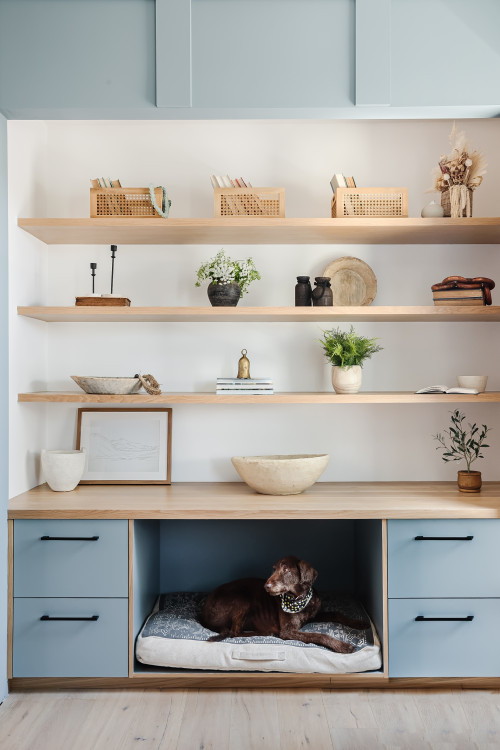 In this dog-friendly design the dog bed is framed by drawers with open shelving above, creating a cozy dog retreat that feels balanced and seamlessly fits into the room’s design.