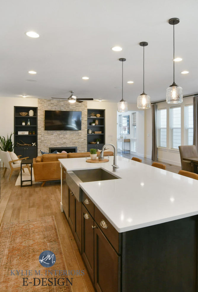 Inspiration for a mid-sized transitional open concept porcelain tile and beige floor living room remodel with white walls, a standard fireplace, a stacked stone fireplace and a wall-mounted tv