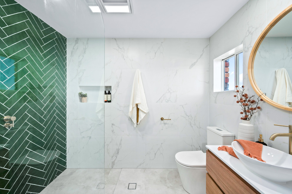 Photo of a small contemporary 3/4 bathroom in Central Coast with medium wood cabinets, an open shower, a two-piece toilet, green tile, white tile, a vessel sink, an open shower, white benchtops, a niche, a single vanity and a floating vanity.