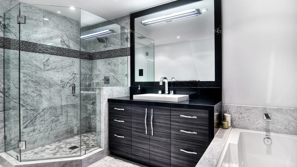 Inspiration for a mid-sized modern gray tile and ceramic tile dark wood floor alcove shower remodel in Orange County with a trough sink, flat-panel cabinets, dark wood cabinets, granite countertops, an undermount tub and white walls