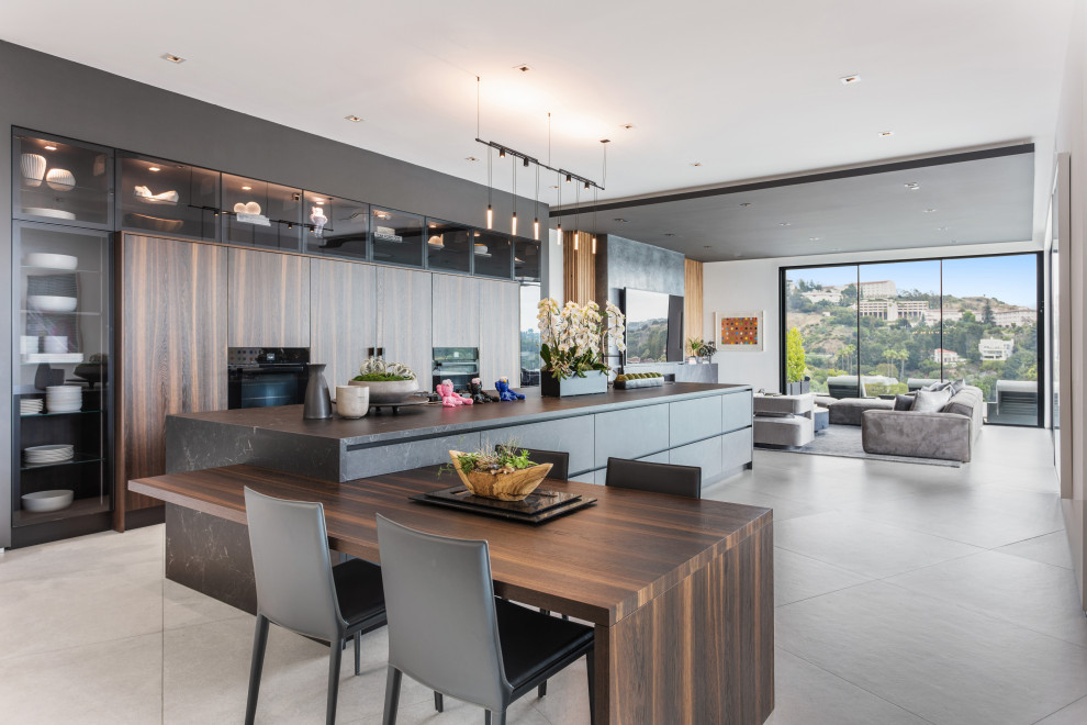 Photo of a large contemporary kitchen in Los Angeles with porcelain floors and grey floor.