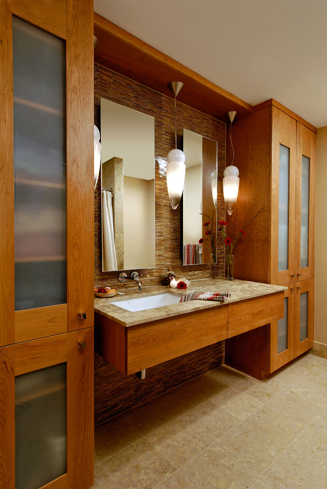 Small modern master bathroom in DC Metro with flat-panel cabinets, medium wood cabinets, an alcove tub, a shower/bathtub combo, multi-coloured tile, beige walls, an undermount sink, granite benchtops, a one-piece toilet, matchstick tile, porcelain floors, beige floor and a shower curtain.