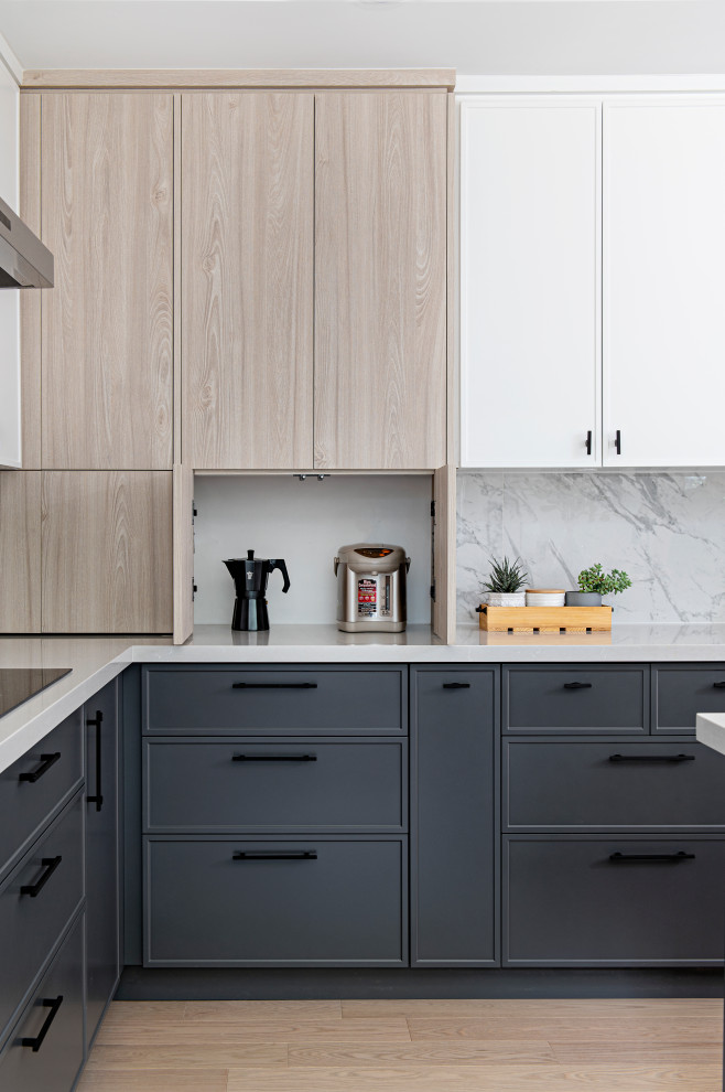 Large danish l-shaped light wood floor eat-in kitchen photo in Toronto with an undermount sink, shaker cabinets, light wood cabinets, quartz countertops, gray backsplash, porcelain backsplash, stainless steel appliances, an island and white countertops