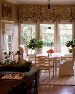 Kitchen - transitional medium tone wood floor kitchen idea with granite countertops and an island