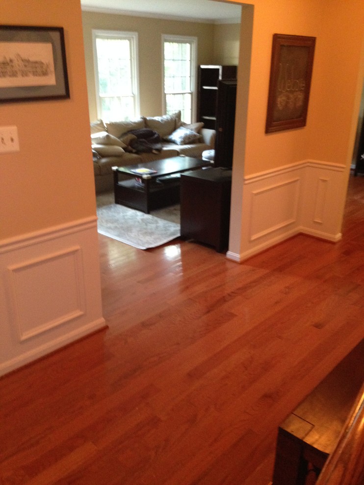 Mid-sized transitional light wood floor hallway photo in DC Metro with beige walls