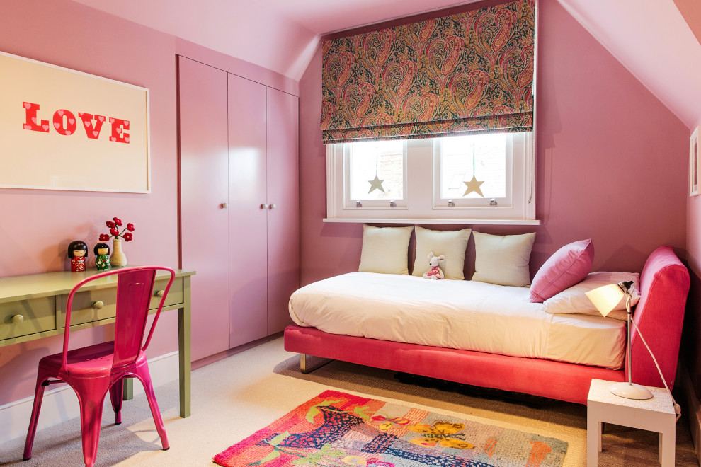 Contemporary kids' bedroom in London with pink walls, carpet, beige floor and vaulted for girls.