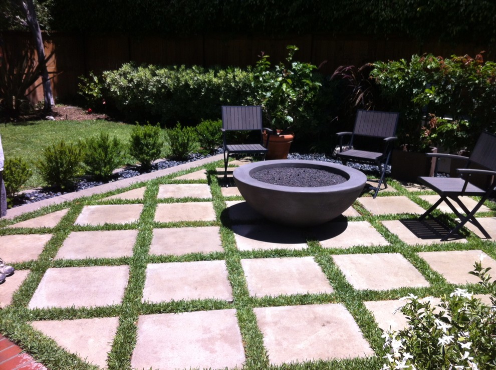 Mid-sized modern backyard patio in Orange County with a fire feature, concrete pavers and no cover.