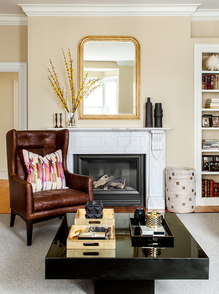 Inspiration for a transitional living room in Boston with beige walls and a standard fireplace.