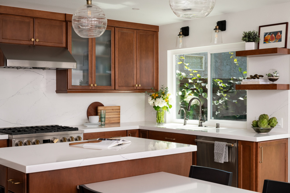 Kitchen - transitional porcelain tile and beige floor kitchen idea in Orange County with an undermount sink, shaker cabinets, medium tone wood cabinets, quartz countertops, white backsplash, quartz backsplash, stainless steel appliances, an island and white countertops