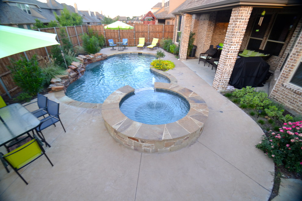 Small country backyard custom-shaped pool in Dallas.