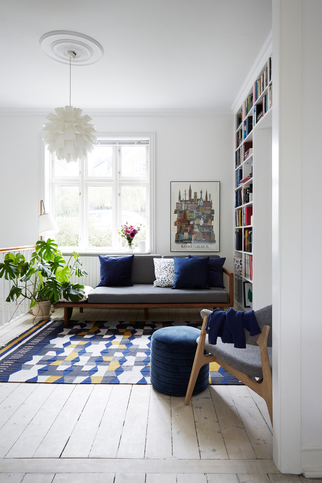 Photo of a mid-sized modern living room in Copenhagen with white walls and no tv.