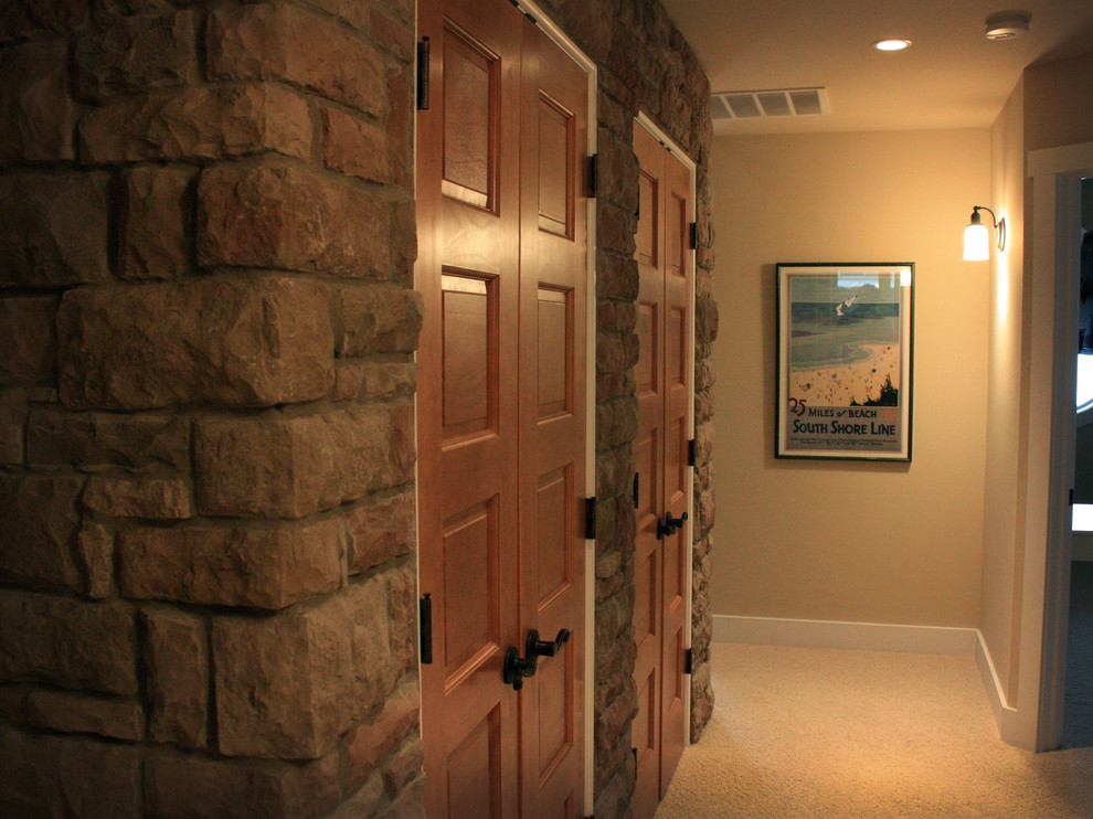 Inspiration for a beach style hallway in Chicago with beige walls and carpet.