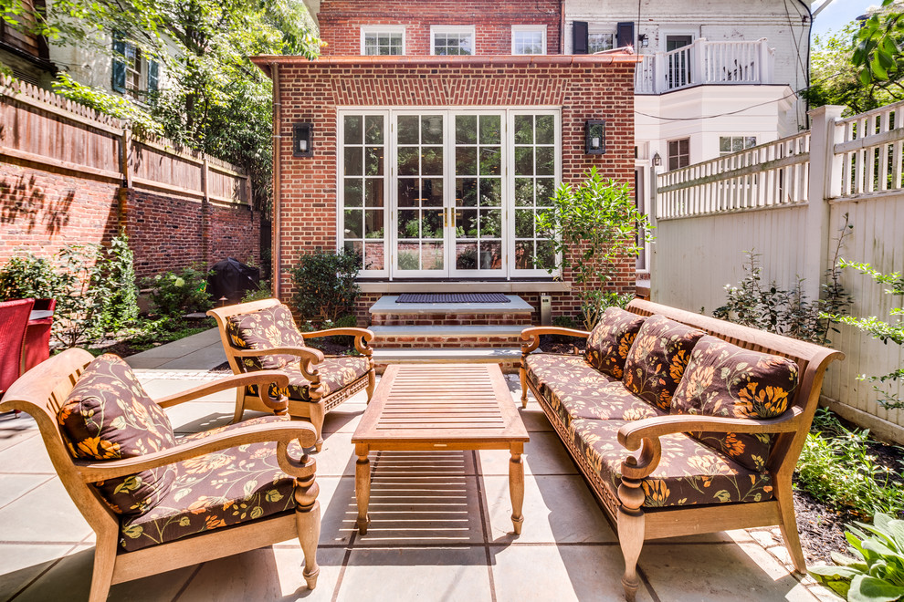 Photo of a mid-sized traditional backyard patio in DC Metro.