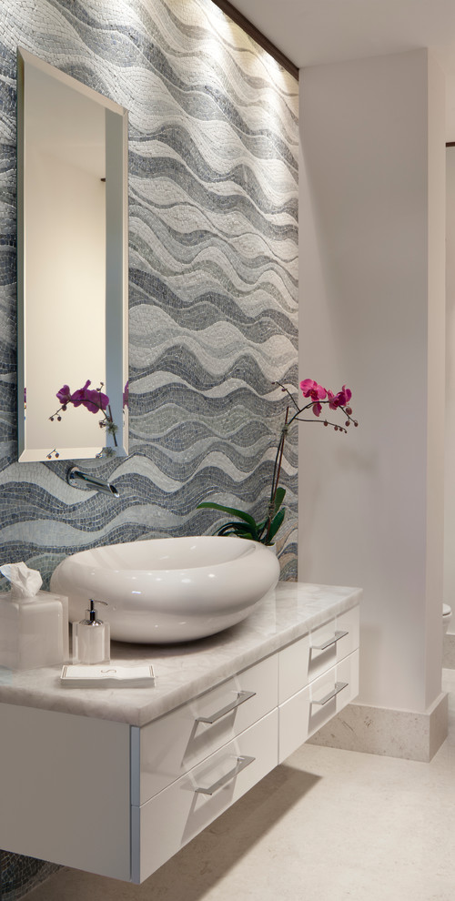 This is an example of a contemporary powder room in Miami with a vessel sink.