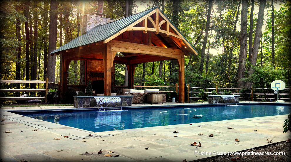 Pool fountain - huge transitional backyard concrete paver and rectangular lap pool fountain idea in DC Metro
