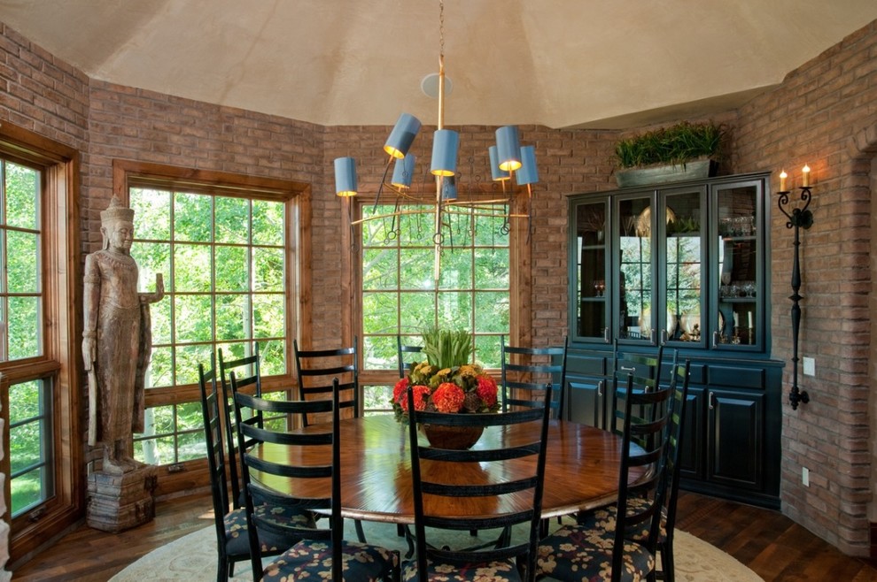 This is an example of a traditional dining room in Denver with dark hardwood floors.