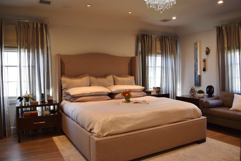 Inspiration for a mid-sized contemporary master bedroom in Los Angeles with beige walls and medium hardwood floors.