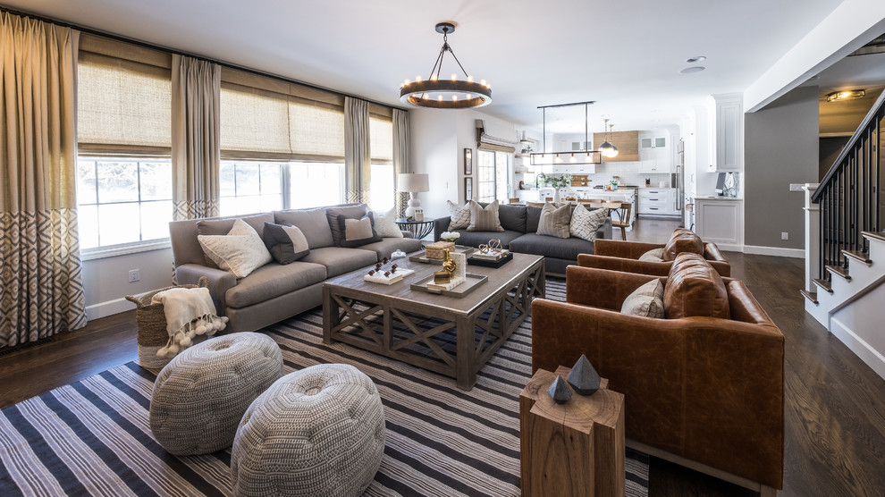 Farmhouse open concept dark wood floor and brown floor living room photo in Detroit with gray walls