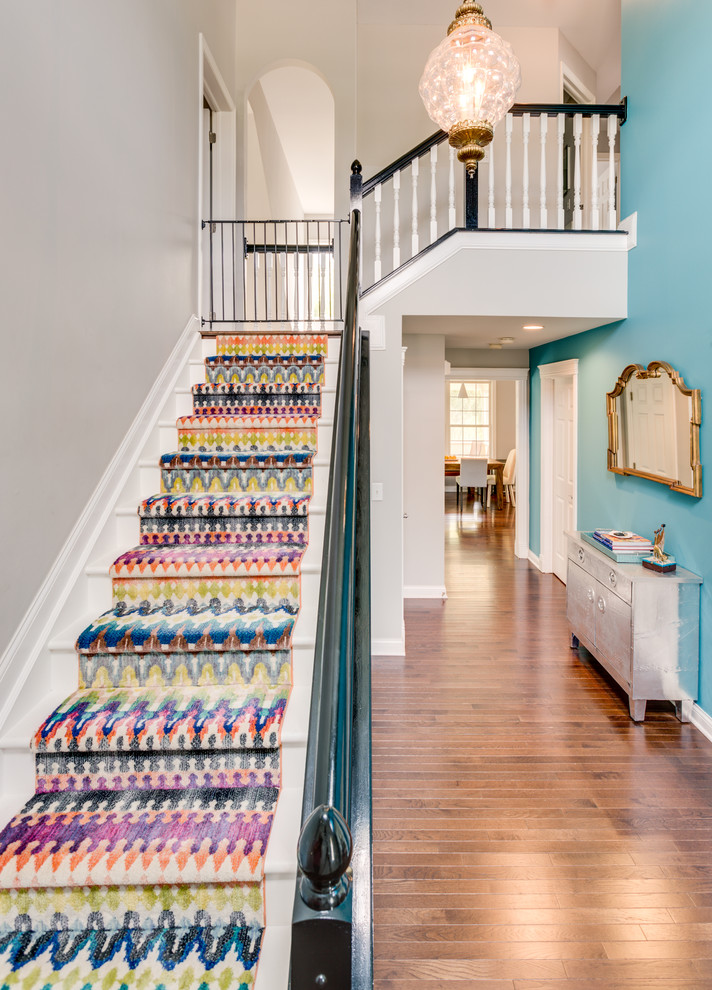 Photo of a mid-sized transitional painted wood l-shaped staircase in Columbus with painted wood risers.