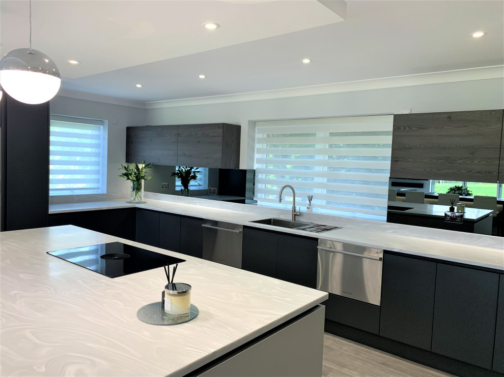 This is an example of a large contemporary u-shaped open plan kitchen in Other with a double-bowl sink, medium wood cabinets, solid surface benchtops, glass sheet splashback, black appliances, with island, white benchtop and recessed.