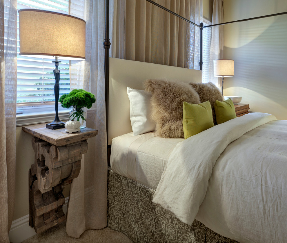 Photo of a transitional bedroom in Miami with beige walls and carpet.